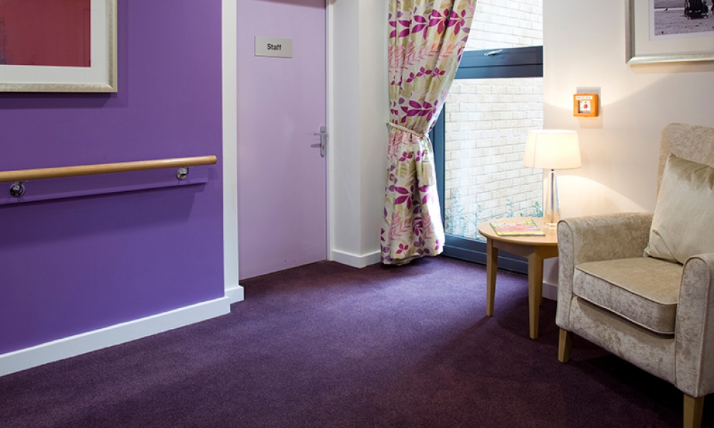 Purple corridor with seating